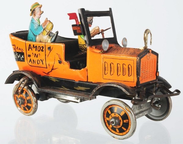 Tin Litho Marx Amos 'N Andy Taxi Wind-Up Toy.: American. Working. Missing dog in front seat and plastic windshield. Some scratching and wear throughout. Condition (Very Good). Size 7 - 1/2" L.