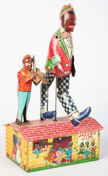 Tin Litho Unique Art Jazzbo Jim Wind-Up Toy.: American. Working. Variation with side violin player. Nice lithographed depictions around base. Some minor scratching and wear overall and some scratching underneath arms. Condition (Very Good - Excel
