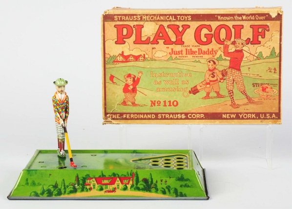 Tin Litho Strauss Play Gold Wind-Up Toy.: American. Working. Original golfer and four original wooden balls. Tin litho base has only minor scratching and wear. Includes original box with nice colorful golf scene on front. Box is marked "No. 1