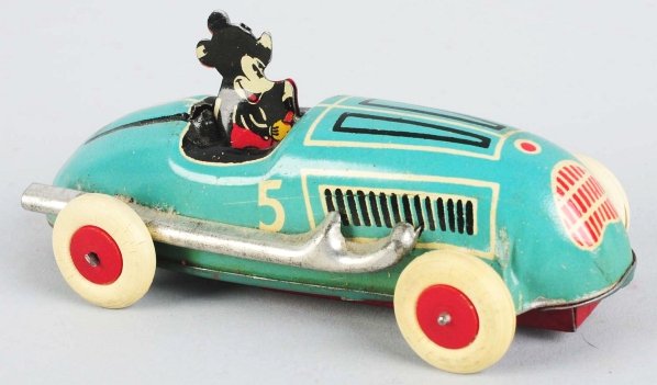 Tin Litho Walt Disney Mickey Auto Wind-Up Toy.: American. Pre-war. Working. Marked "Made in USA" and "5". Replaced white rubber tires. Some slight wear overall. Condition (Very Good - Excellent). Size 4" L.