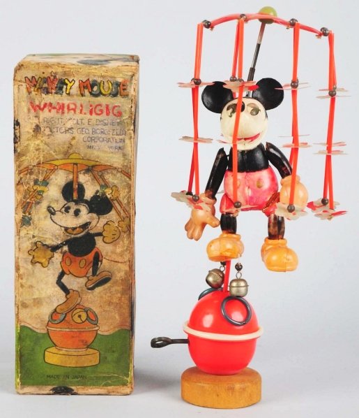 Celluloid Walt Disney Mickey Mouse Whirligig Toy.: Japanese. Pre-war. Wind-up mechanism is working. Toy is all original but does have some fading to red areas. Top of umbrella is slightly misshapen. One very small crack at key-wind. Includes scarce or