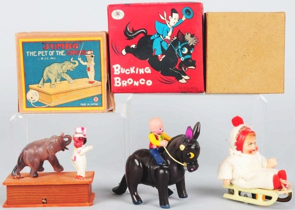 Lot of 3: Tin & Celluloid Wind-Up Toys.: Japanese. Working. Includes one Jumbo Pet of the Circus, one Bucking Bronco, and one Child on Sled. Includes all original boxes. Condition (Excellent). Size Largest: 6".