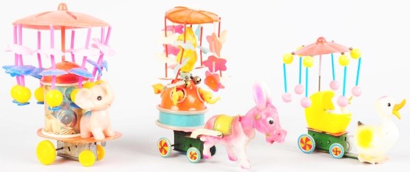 Lot of 3: Celluloid Animal Wind-Up Toys.: Japanese. Working. Includes one pulled by a donkey, one pulled by an elephant, and one pulled by a duck. All with celluloid whirligigs on top. Various conditions. Condition (Very Good). Size Largest: 