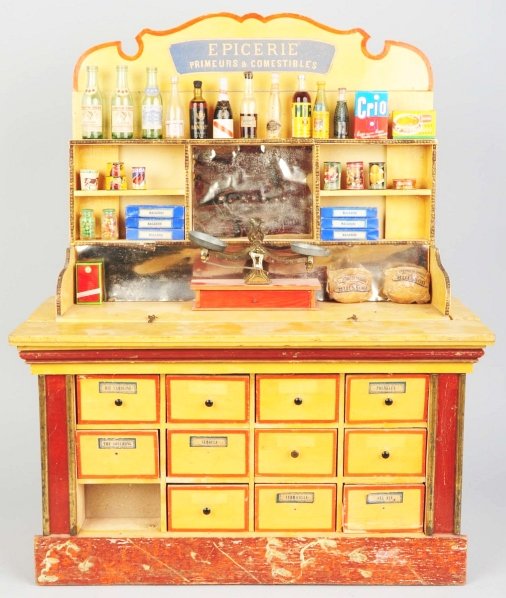 Large Wooden Grocery Display Unit.: French. Pre-war. Headpiece reads "Epicerie Primeurs & Comestibles". Comes with vintage liquor bottles and other grocery store toy items like cans, etc. Some wear overall. Condition (Very Good). Size 3