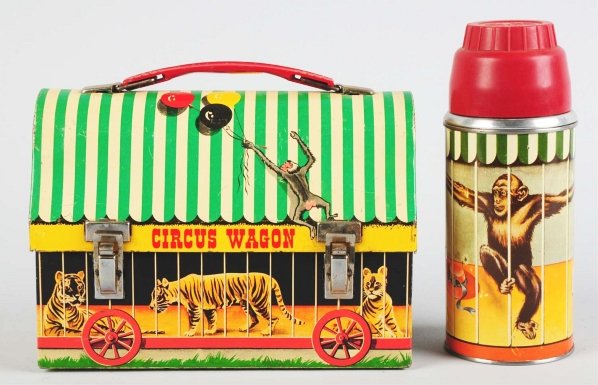Tin Litho Circus Wagon Dome Lunch Box.: Circa 1958. American Thermos Company. Scarce box with matching thermos. Made to look like a mobile animal cage. Some oxidation to bare metal hinges, some denting to back, and moderate scratching to th