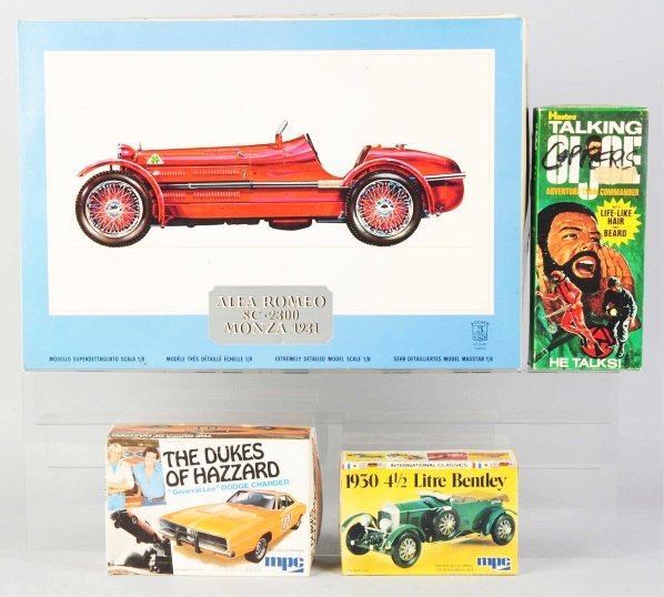 Lot of 4: Automobile & G.I. Joe Toys.: Includes one Hasbro bearded G.I. Joe model no. 7400 marked "1970" and missing voice mechanism. Also includes Dukes of Hazard model kit, MPC Bentley, and 1931 Alfa Romeo Monza model kit. Includes all o