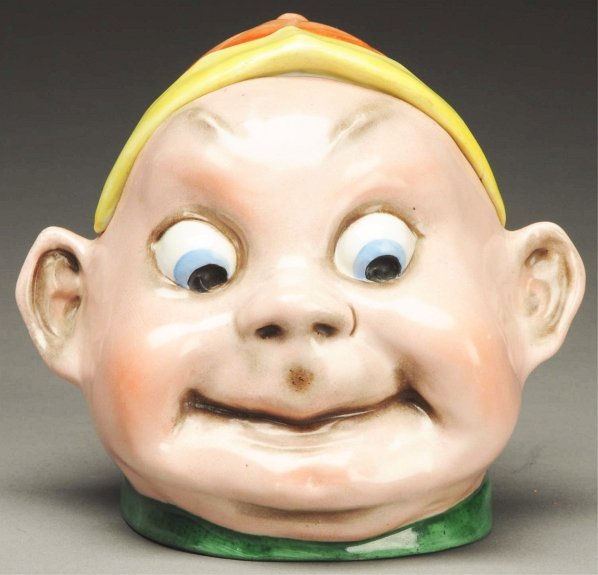 China Brownie Head Candy Container.: Opens at hat. Appears to have very little wear. Condition (Excellent). Size 5 - 1/2" T.