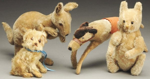 Lot of 4: Stuffed Mohair Animals.: Includes one kangaroo (circa 1930s) still retaining button in ear, one greyhound dog with glass eyes and turning head, one squirrel with shoe button eyes, and one other stuffed animal. Condition (Good