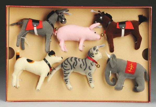 Set of Steiff Limited Edition Animals.: 1997 set to commemorate the 150th birthday of Margarete Steiff. Set of small velvet animals made like her earliest models – donkey, pig, horse, dog, cat, and elephant. Tied in original box with cert