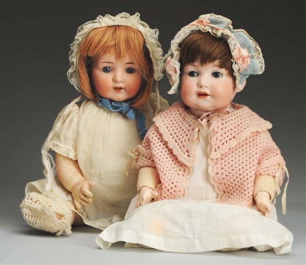 Lot of 2 German Bisque Dolls.: Both bisque socket head character babies by Armand Marseille, molds 971 and 995 with sleeping eyes (eyelid wax missing from 1), human hair wigs, open mouths with upper teeth, composition baby bodies (