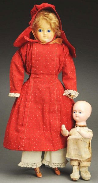 Lot of 2 German Wax Over Dolls.: Bald head baby with inset glass eyes, closed mouth, mechanical bellows moves arms and head, composition arms, wire upper legs (lower legs missing). Sweet child (cracks on face) with glass sleeping eye