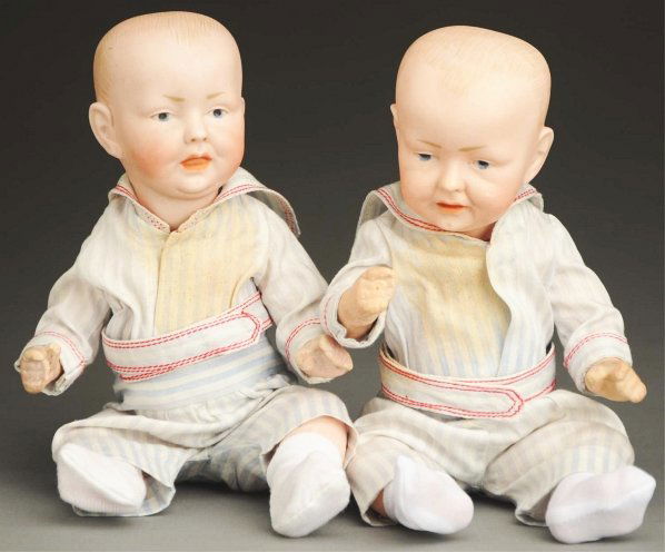 Lot of 2 Character Baby Twins.: German bisque socket heads incised “150 0 ½” with solid dome heads, painted hair, slanted one-stroke eyebrows, intaglio eyes with molded upper eyelids, open/closed mouths, great facial modeling,