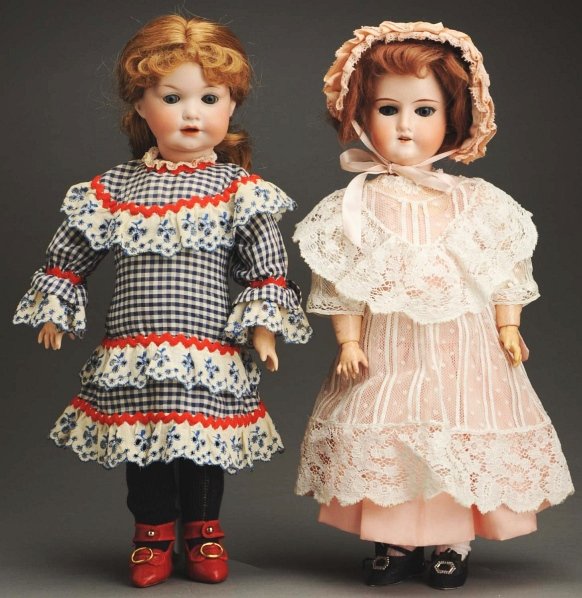 Lot of 2 German Bisque Dolls.: Socket head incised “Made in Germany 1912” by Cuno & Otto Dressed, tapered 1-stroke eyebrows, glass sleeping eyes, open mouth, jointed composition body; socket character head incised “Germany 97