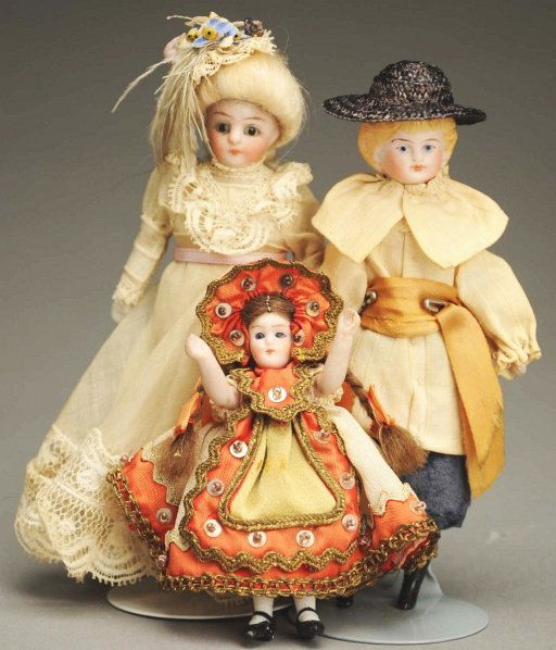 Lot of 3 German Dolls.: Beautiful doll house lady with bisque shoulder head with glass eyes, original fancy mohair wig, cloth body with bisque lower limbs, lovely clothes; doll house boy with bisque shoulder head with molded