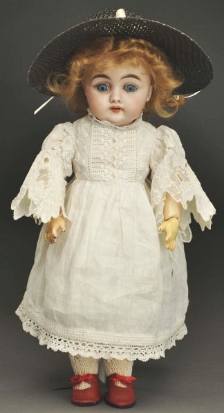 Sweet Kestner Character Doll.: German bisque socket head incised “C made in Germany 7,” same mold as the 143 face (light cheek rub); multi-stroked long brown eyebrows, blue sleep eyes, painted upper and lower eyelashes, open mo