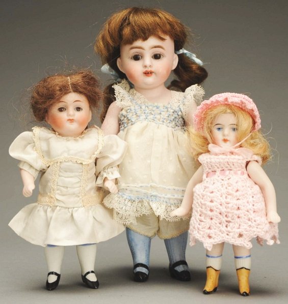 Lot of 3 German All Bisque Dolls.: Girl incised 208 on all parts, glass eyes, mohair wig, jointed shoulders and hips, new silk dress; Kestner girl incised 150 on all parts, original mohair wig, glass eyes, multi-stroked eyebrows, open 