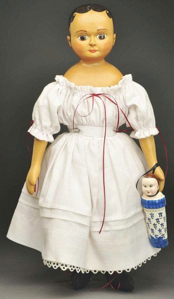 Patti Hale Artist Doll.: Wood shoulder head signed “Patti Hale 91 NIADDA” done in a primitive painting style with painted curly hair, large painted brown eyes, closed mouth, cloth body with wooden lower arms, 1850s style