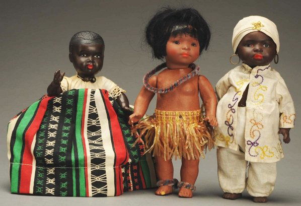 Lot of 3 German Black Character Dolls.: Ernst Heubach “South Seas” character with ceramic head, inset eyes, mohair wig, composition body with grass skirt; Mold 399 painted bisque black doll with inset eyes, closed mouth, composition bod