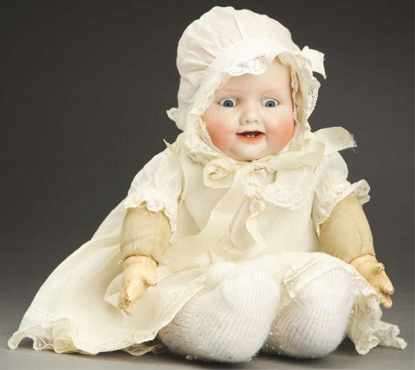 Sweet Averill “Bonnie Babe” Doll.: Bisque head incised “Copr by Georgene Averill 1005/3652 Germany,” with curly molded hair, blue glass sleeping eyes, open mouth with tongue and two lower teeth; chubby cloth body with composition h