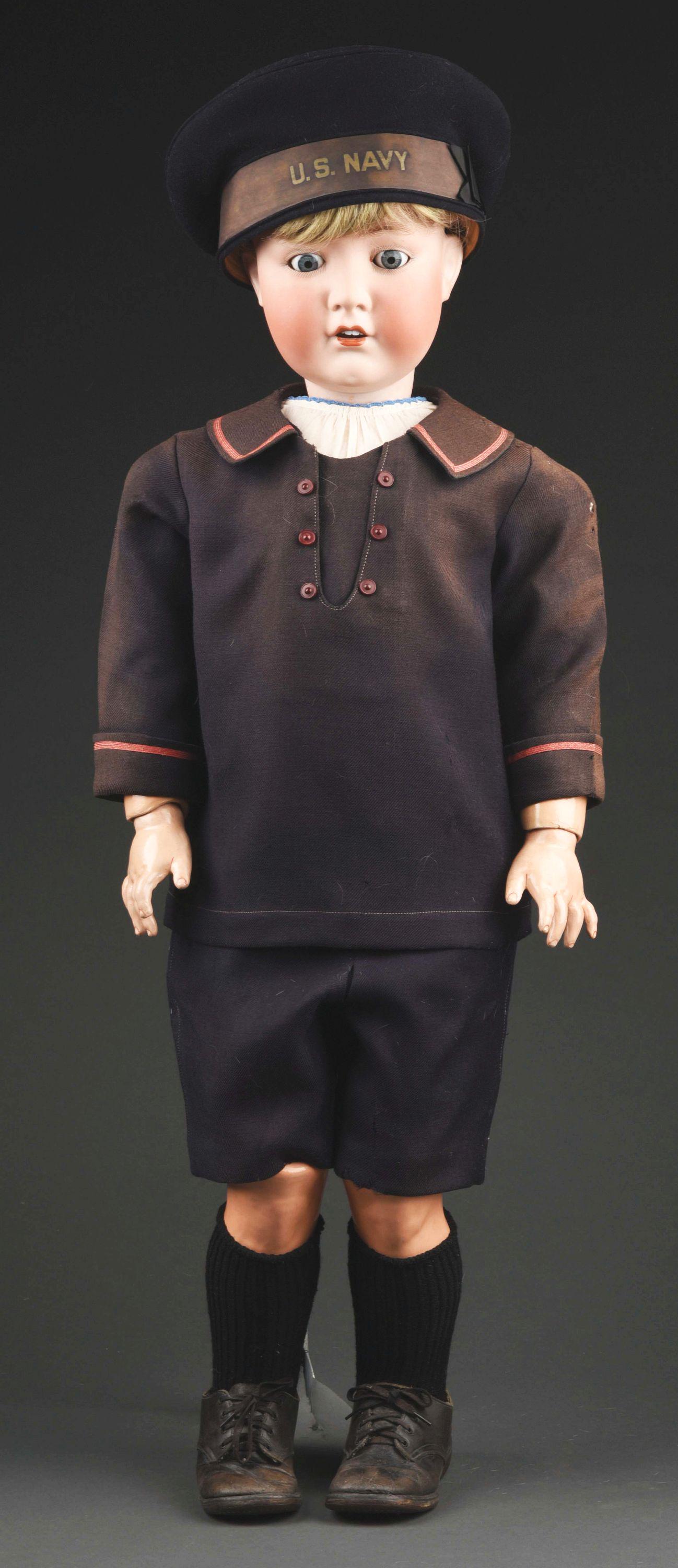 MOST IMPRESSIVE GERMAN BISQUE HEAD DOLL BY DRESSEL.: 36" (91 cm) bisque socket head doll, incised on back of head "Cuno & Otto Dressel Germany." He has blue glass sleep eyes, open mouth with four upper teeth, well-painted lashes and multi-stroke eyebrow