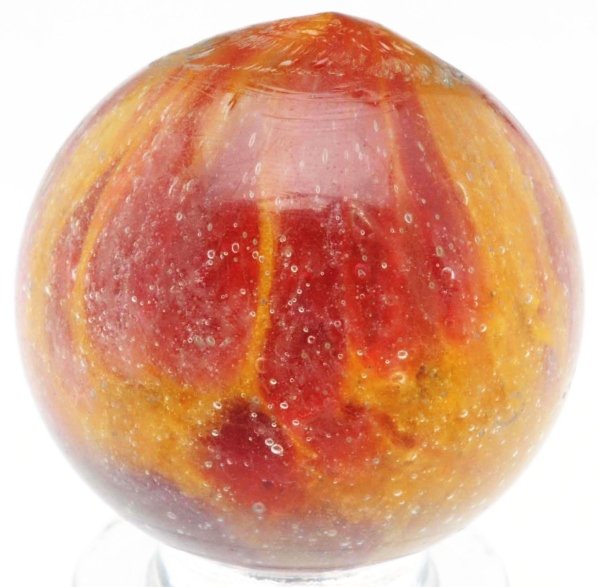 Single Pontil End of Day Marble.: Yellow base with good spotting of red. Top of marble colors form a small tail. Condition (9.5). Size 15/16" Dia.