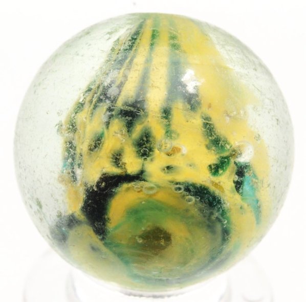 Single Pontil Cloud Marble with Mica.: Faceted pontil. Yellow and green with nice distribution of mica. Colors opposite of the pontil have a nice number nine twist at top. Surface shows wear, minor flea bites, and one as-made surface blowo