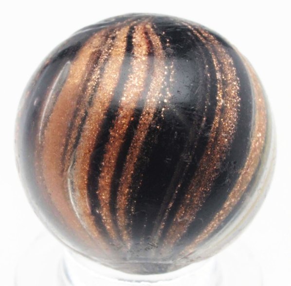 Indian Lutz Marble.: Black opaque base with stripes in white, yellow, and blue. This marble is loaded with lutz. Several small chips throughout. Condition (8.7). Size 3/4" Dia.