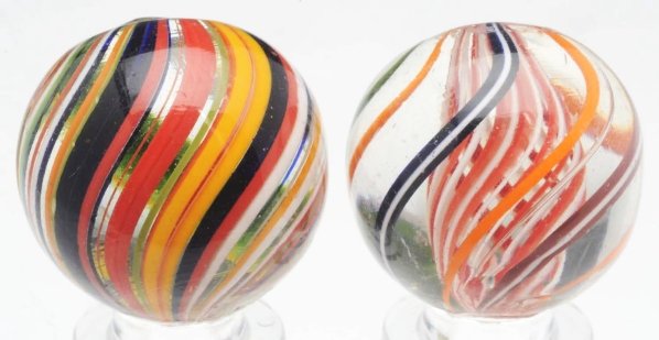 Lot of 2: Handmade Swirl Marbles.: The smaller marble is a beautiful alternating red and white latticino swirl with outer bands of orange, brown/white, green/white, and black/white. The larger marble is a multicolored Joseph's Coat wit