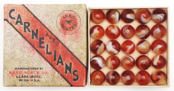 Akro Agate No. 1 Box Set of Carnelian Agates.: Box includes 25 beautiful Carnelian marbles. Box top shows staining while the box bottom is in great shape. Condition Marbles (9.5) Box (Good). Size Range: 21/32" to 22/32" Dia.