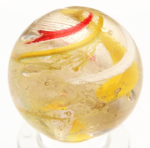 End of Cane Latticino Swirl Marble.: Faceted pontil. Yellow latticino core with outer decorations in red, yellow, and white bands. Latticino and outer decorations stop about half way up the marble and parts of the canes spin at top. Nice