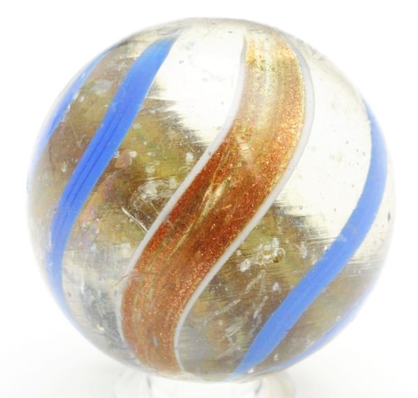 Large Banded Lutz Marble.: Transparent base with blue banding and wide lutz banding. Several subsurface reflections and minor chipping. Condition (8.6). Size 1 - 7/16" Dia.