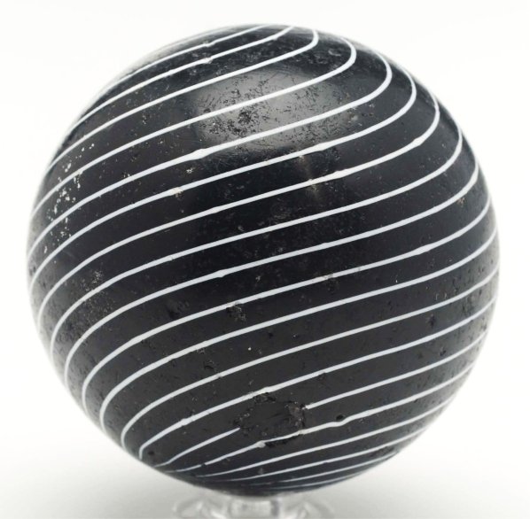Large Black Clambroth Marble.: Black opaque base with 20 evenly spaced white lines. Marble has one large, shallow chip near top pontil and several minor, small chips. Condition (8.7). Size 2 - 1/8" Dia.