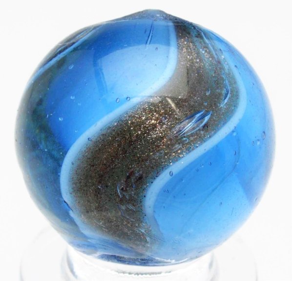 Blue Glass Ribbon Lutz Marble.: White ribbon in blue glass. Great twist to ribbon in lutz bands. Fat, wide, and bold lutz banding. One as-made cold roll mark near top pontil. Condition (9.3). Size 25/32" Dia.