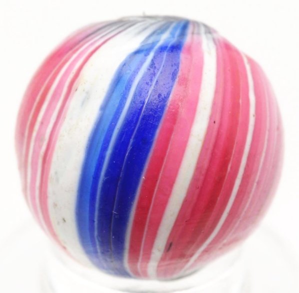 360° Indian Style Uncased Onionskin Marble.: Clear transparent base with 360° color coverage in red, white, and blue. One as-made cold roll mark near top pontil. Condition (9.4). Size 5/8" Dia.