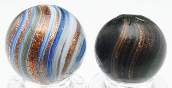 Lot of 2: Lutz Marbles.: The largest marble is a beautiful onionskin lutz with white and blue striping and loaded with lutz striping. The smaller marble is a green glass lutz with nice banding. This marble has an as-made hot 