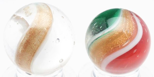 Lot of 2: Ribbon Lutz Marbles.: The smallest is a red and green ribbon lutz. Lutz bands are accented with white. The larger marble is a hard-to-find all white ribbon lutz. Both marbles have been polished with minor damage still pres