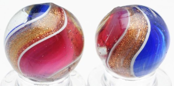 Lot of 2: Same Cane Ribbon Lutz Marbles.: Pair of same cane red and blue ribbon lutz marbles. Both marbles with wide lutz bands. Condition (9.2 - 9.7). Size 5/8" to 11/16" Dia.