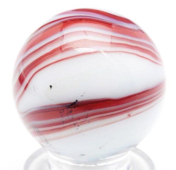 M.F. Christensen & Son Brick Marble.: This is one of the nicest brick marbles we have ever seen. Approximately half white and half oxblood. Great twist of oxblood on a rare white base. Condition (9.4). Size 13/16" Dia.