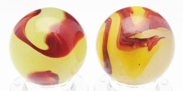 Lot of 2: Akro Agate Oxblood Marbles.: Includes one egg yolk oxblood in lemonade glass and one lemonade oxblood. Both marbles have nice patterns. Condition (9.3). Size Each: 23/32" Dia.