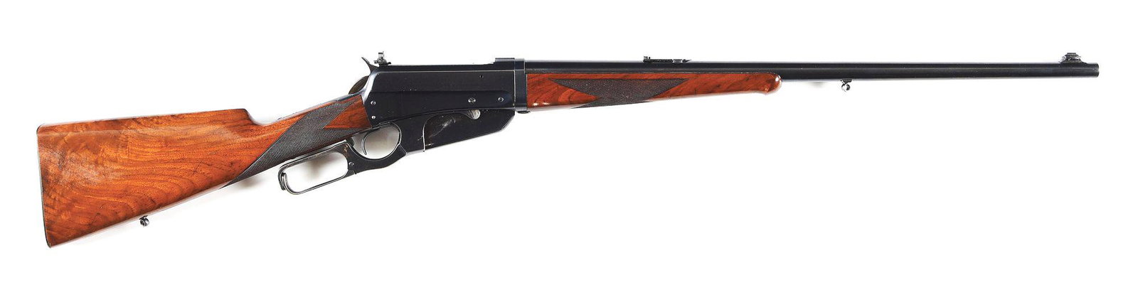 (C) CASED DELUXE TAKEDOWN WINCHESTER MODEL 1895 LEVER ACTION RIFLE.: Made by Winchester Repeating Arms in 1923. Standard 24" round Nickel Steel takedown barrel with Marble fold-down rear sight and integral dovetailed bead blade front sight and Winchester address with "