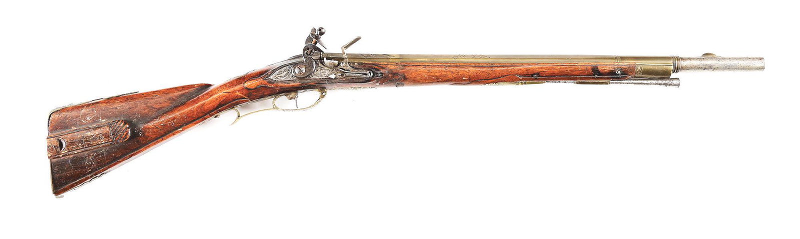 (A) FLINTLOCK JAEGER CARBINE WITH AN UNUSUAL BRASS SHEATHED BARREL.: Unusual brass sheath measures approximately 19" to rear of breech and is formed in two stages, the first octagonal and engraved with a stand of arms depicting a crossed pair of horns, two flags, and c