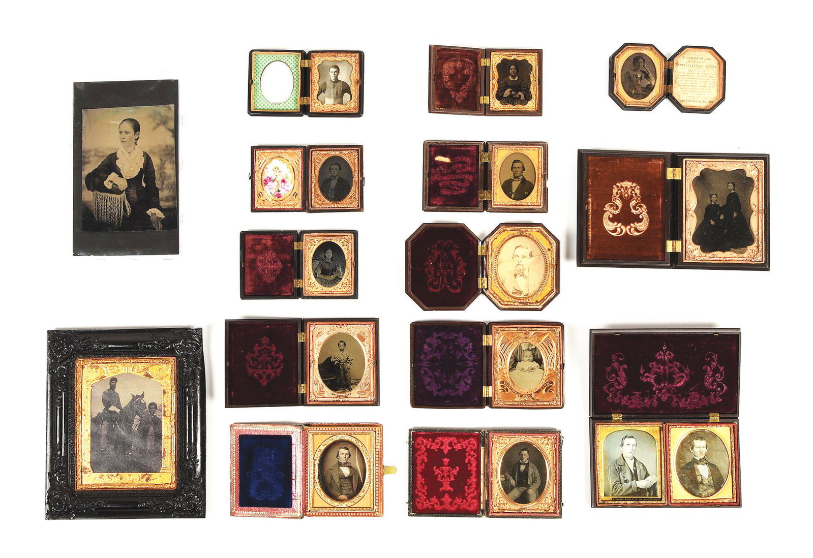 LARGE LOT OF CIVIL WAR TINTYPES AND AMBROTYPES.: Lot of 14 cased civilian hard images with highlights being double-cased 6th plate daguerreotypes and 2 patriotic motif thermoplastic cases. CONDITION: Varying states of near mint to separated hinges w