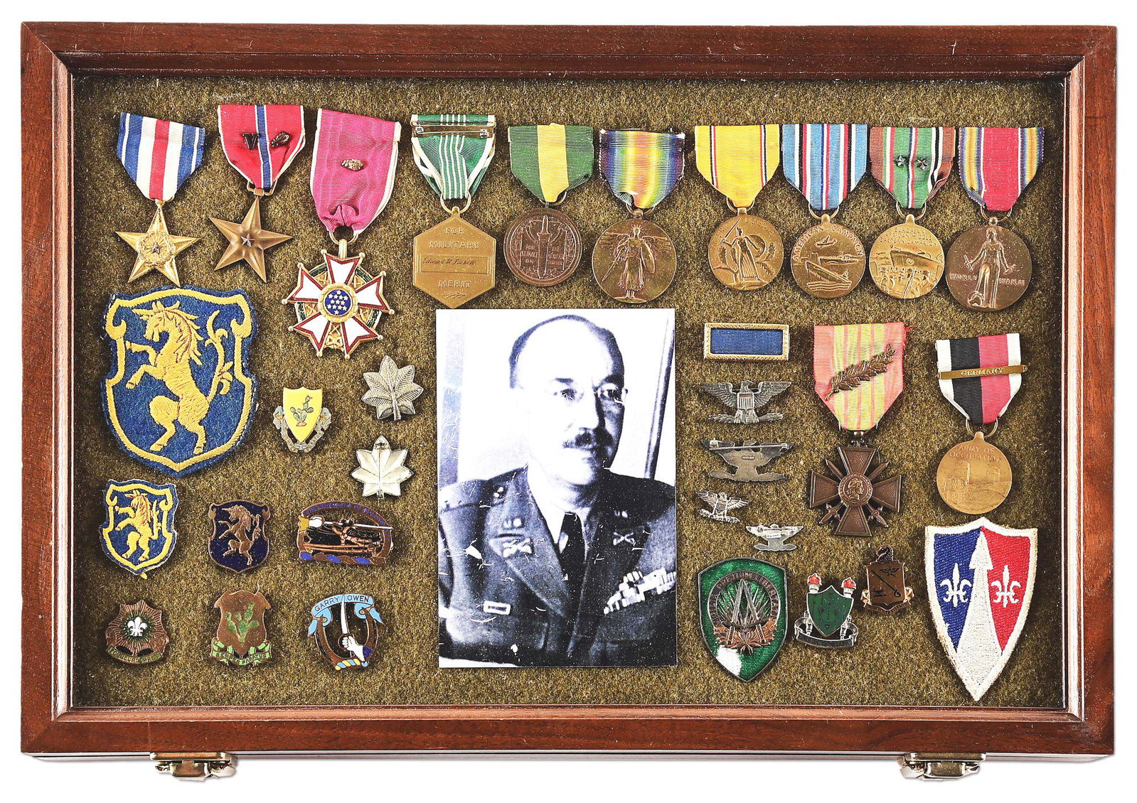 FANTASTIC WWI-WWII MEDAL GROUP NAMED TO CAREER CAVALRYMAN COL. EDWARD M. FICKETT.: Edward M. Fickett (1895-1973) served in the army 1917-1954, earning 2 silver stars, the Legion of Merit, 2 bronze stars, 4 commendation medals, the French Legion of Honor, 6 battle stars, and the nick