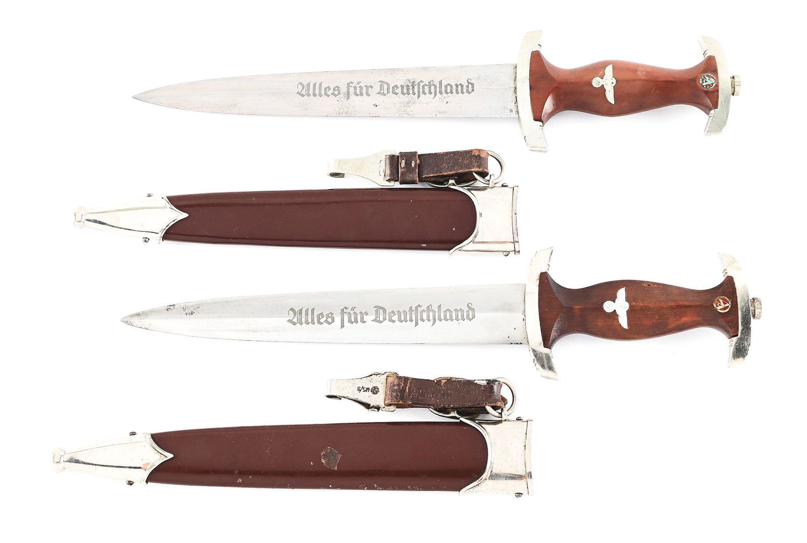 LOT OF 2: THIRD REICH SA DAGGERS.: Lot consists of: (A) Third Reich SA dagger marked "HAMMERSFAHR CIE. SOLINGEN" nickel-plated steel blade with light runner and scattered marks, light freckling, and visible cross graining. The acid-etc