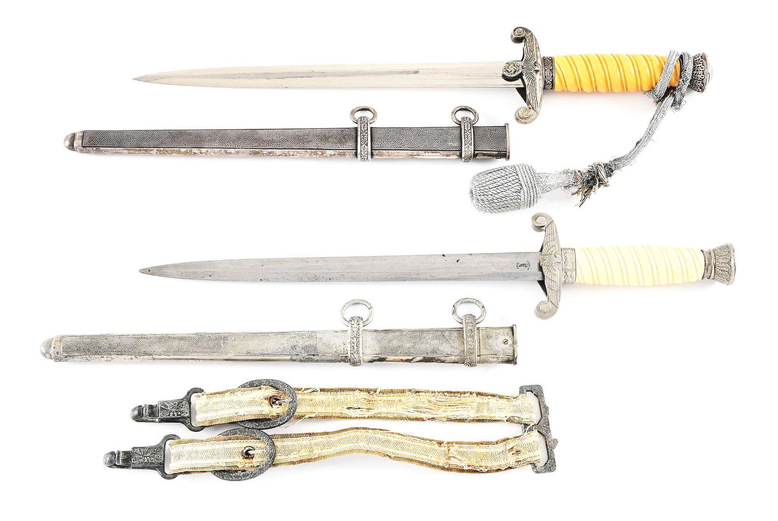 LOT OF 2: THIRD REICH HEER DAGGERS.: Lot consists of (A) Heer dagger with "GEBR HELLER" marked blade with no visible cross graining and evidence of an older polishing. Visible runner mark with scattered blemishes throughout its length. N