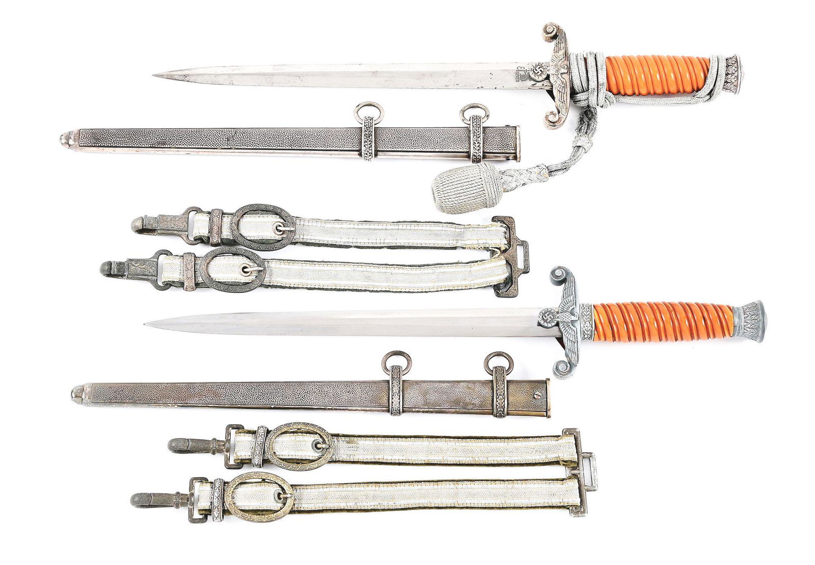 LOT OF 2: THIRD REICH HEER DAGGERS.: Lot consists of (A) Heer dagger with "ORIGINAL EICKHORN SOLINGEN" marked blade with nice cross graining, moderate runner and scattered marks, and light freckling. Nickel silver plated fittings retain