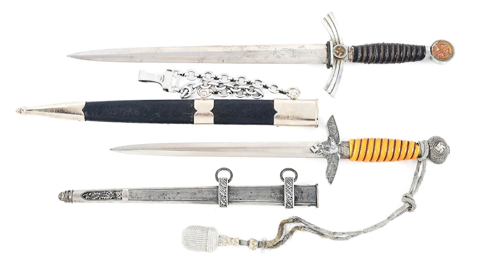 LOT OF 2: GERMAN WWII FIRST AND SECOND MODEL LUFTWAFFE DAGGERS.: Lot consists of: (A) Luftwaffe 1st model dagger with a "Siegfried Waffen, Solingen" marked blade with moderate runner and scattered marks, as well as light freckling and staining throughout. Visible c