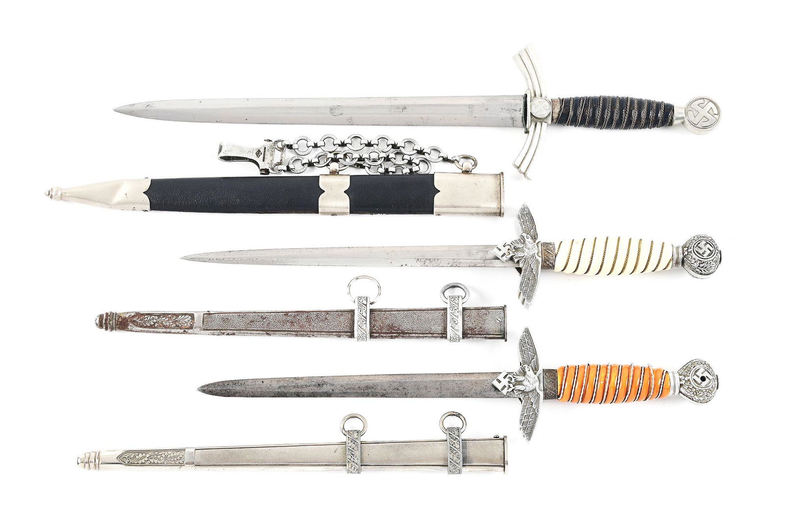 LOT OF 3: 1 FIRST MODEL AND 2 SECOND MODEL LUFTWAFFE DAGGERS.: Lot consists of: (A) Luftwaffe 1st model dagger with a "EMIL VOOS SOLINGEN" marked blade with moderate runner and scattered blemishes throughout. Older polishing. Aluminum fittings have wear and a nic