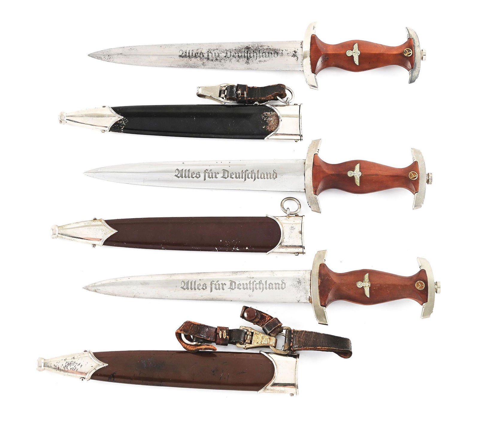 LOT OF 3: THIRD REICH SA & NSKK DAGGERS.: Lot consists of: (A) Third Reich NSKK dagger with "RZM M7/13" marked nickel-plated steel blade with runner marks, scattered blemishes, and freckling throughout its length. Nickel-plated fittings retai