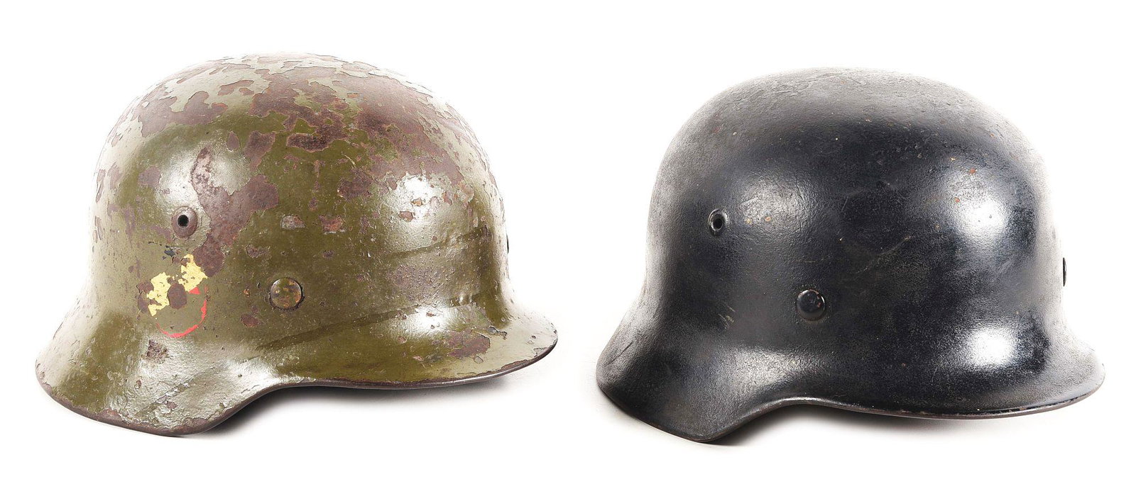 LOT OF 2: GERMAN WWII HEER M35 DOUBLE DECAL HELMET AND M40 HELMET.: Lot contains: (A) German WWII Heer M35 double decal helmet marked "xx68" for an illegible maker, in a shell size of 68, with a partilaly visible lot number. Shell exterior retains 55-60% of its origin